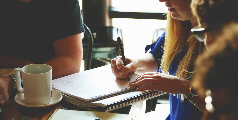 photo of team working at coffee shop