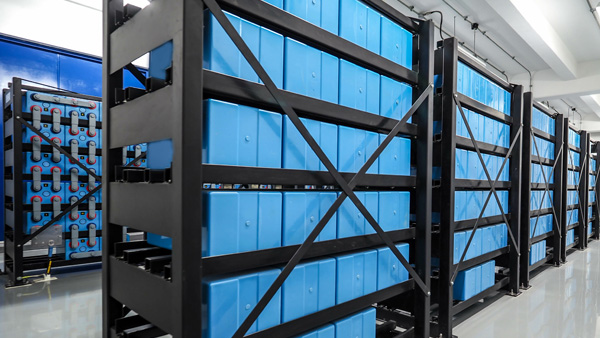 An energy storage facility with racks of batteries