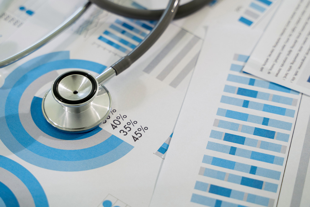 Medical charts and data with a stethoscope