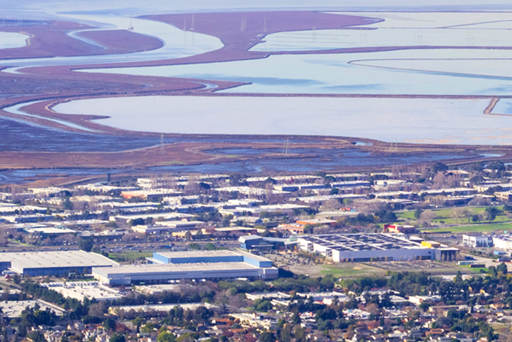 Corporate and industrial buildings near a river and bay